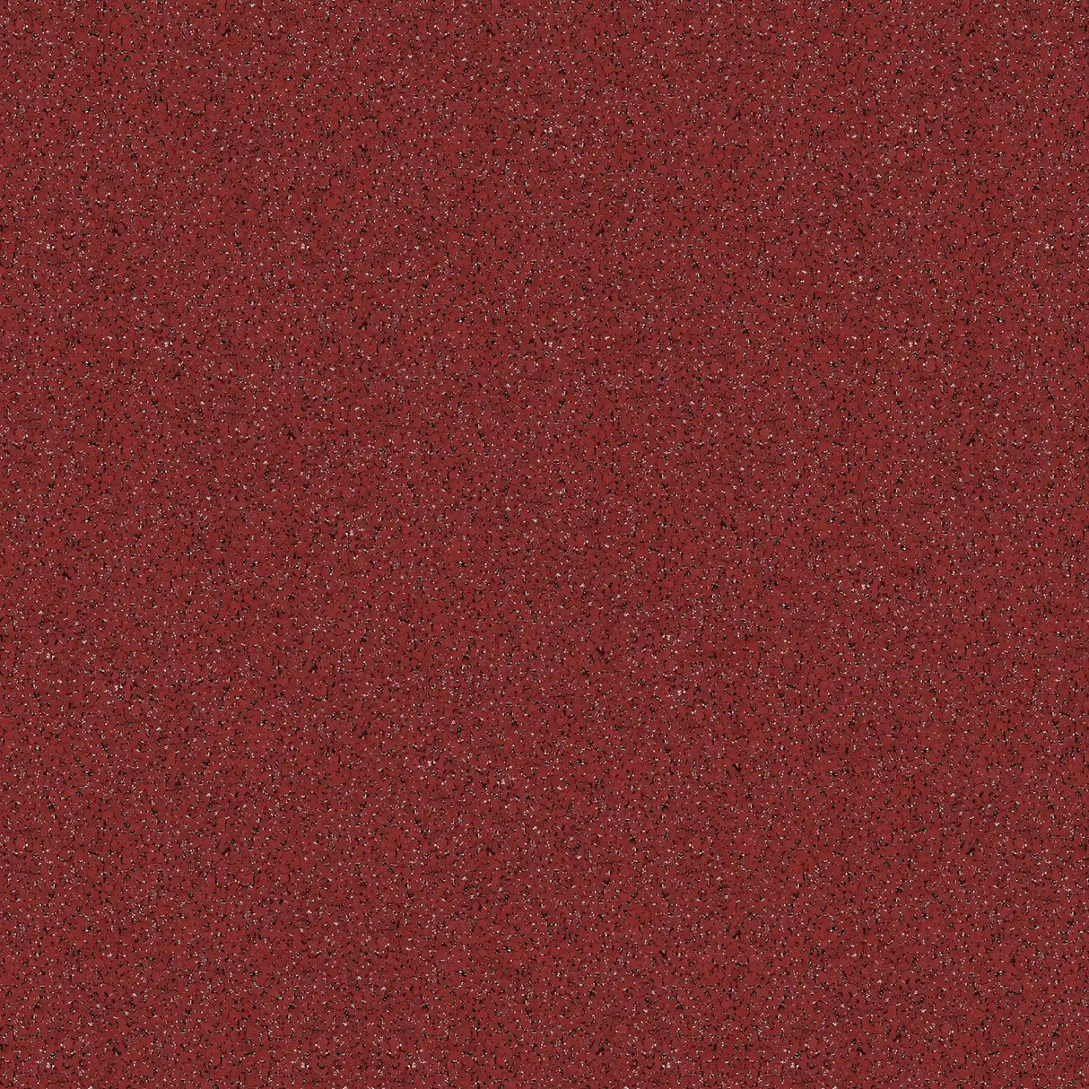 A close-up of ECORE Performance Motivate Plus Rubber Roll - 10.5mm Flooring by ECORE Athletic shows its textured red surface with small dark and light speckles scattered throughout.