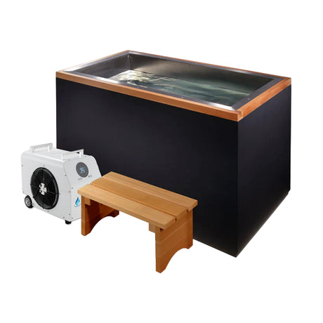 Black cold plunge with a wooden step stool and a white chiller next to it