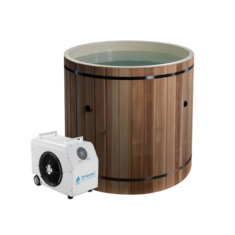 Cedar barrel cold plunge with a chiller on the ground next to it