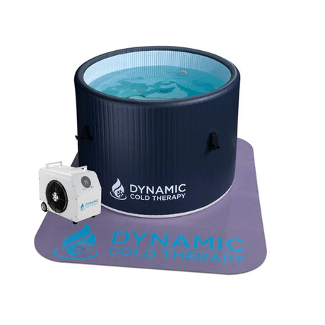 Dark blue inflatable cold plunge on top of a non-slip mat with a chiller next to it