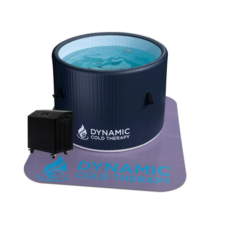 Dark blue inflatable cold plunge on top of a non-slip mat with a chiller next to it