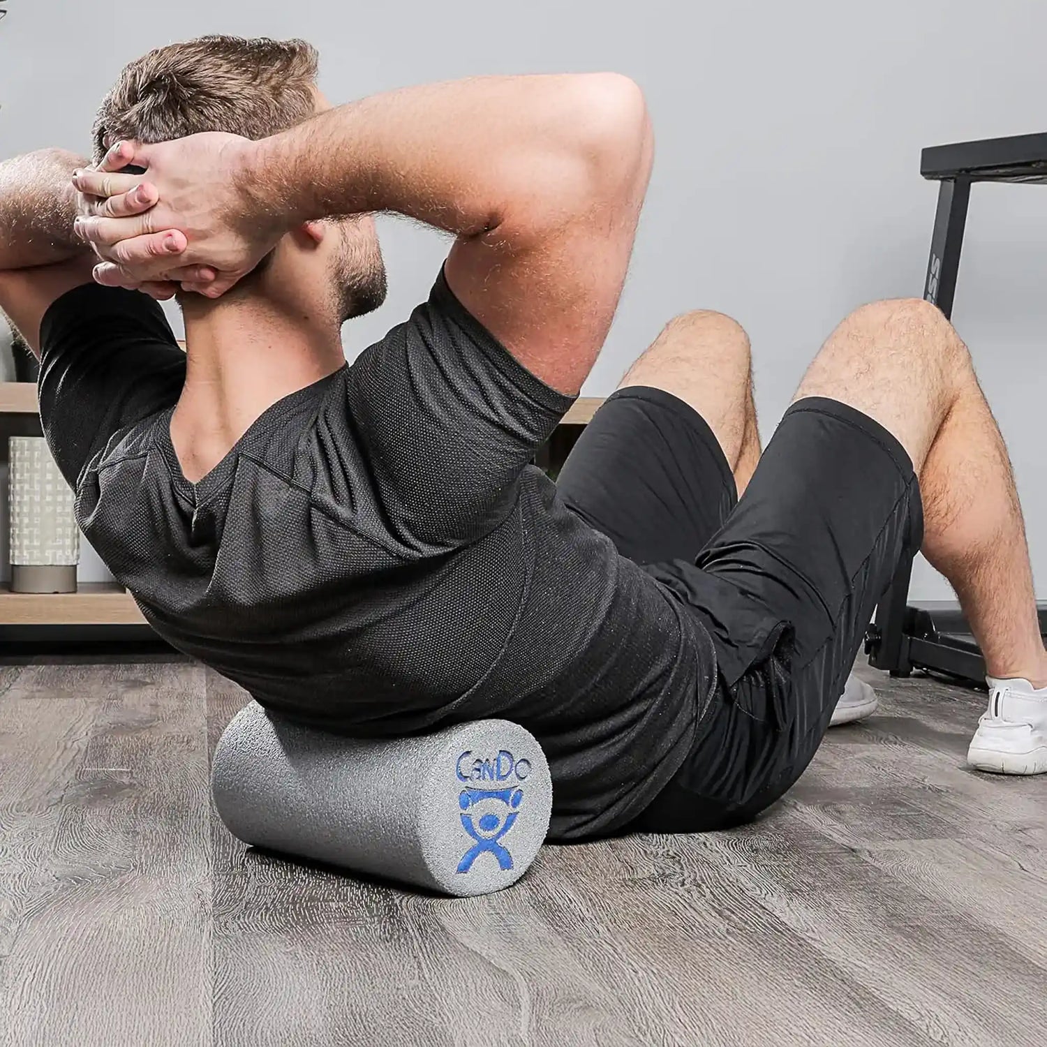 Man rolling back on open cell foam short foam roller by CanDo