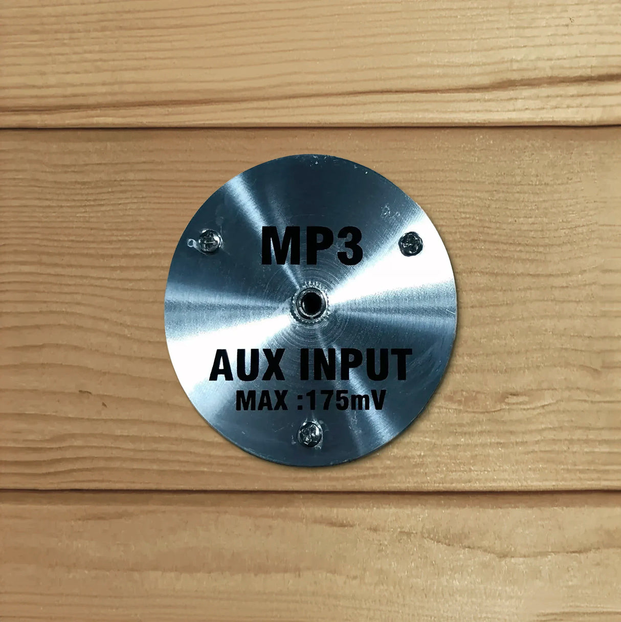 MP3 auxiliary jack built into the inside of a wooden sauna