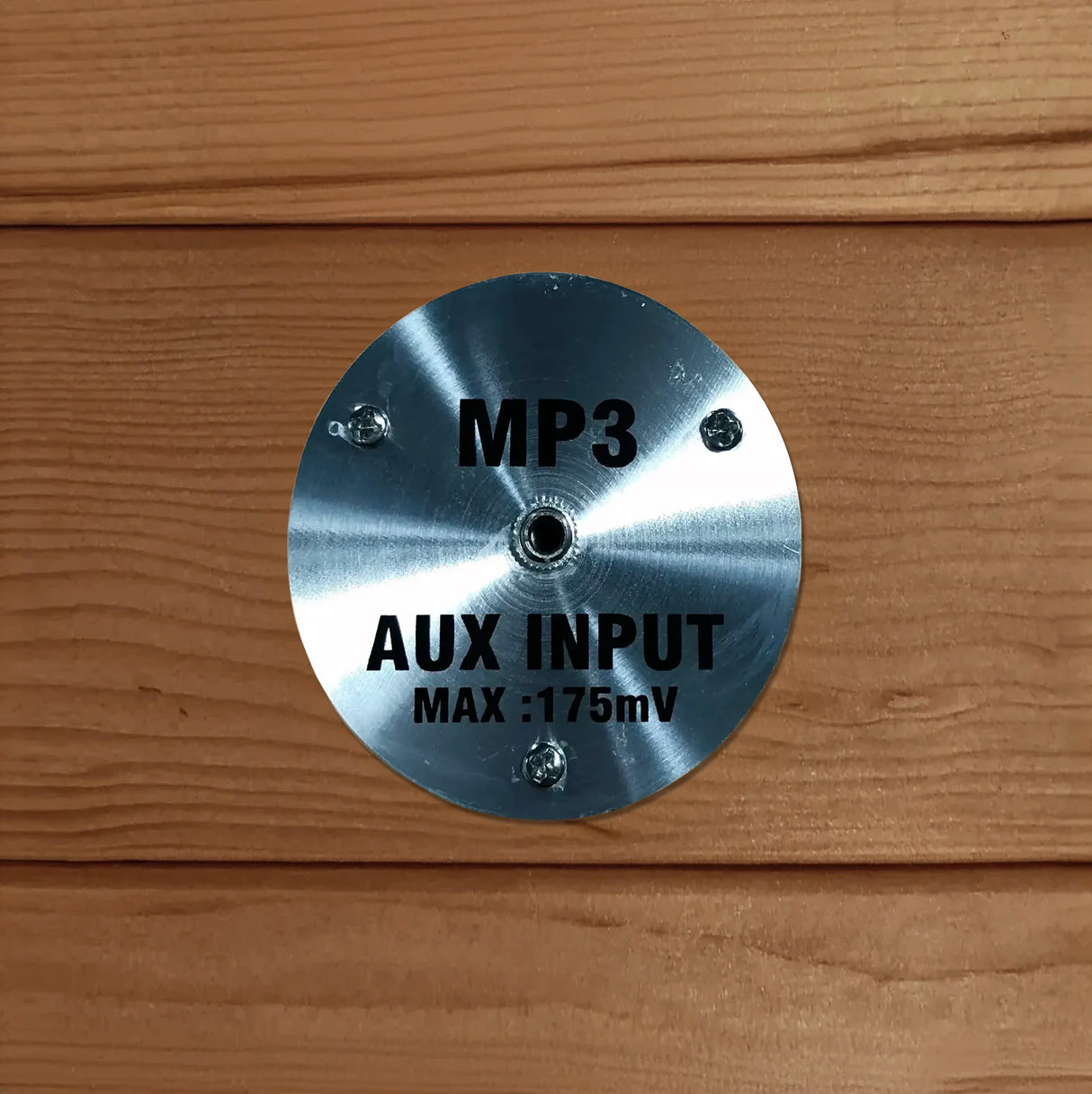 MP3 AUX cord input in a wooden sauna