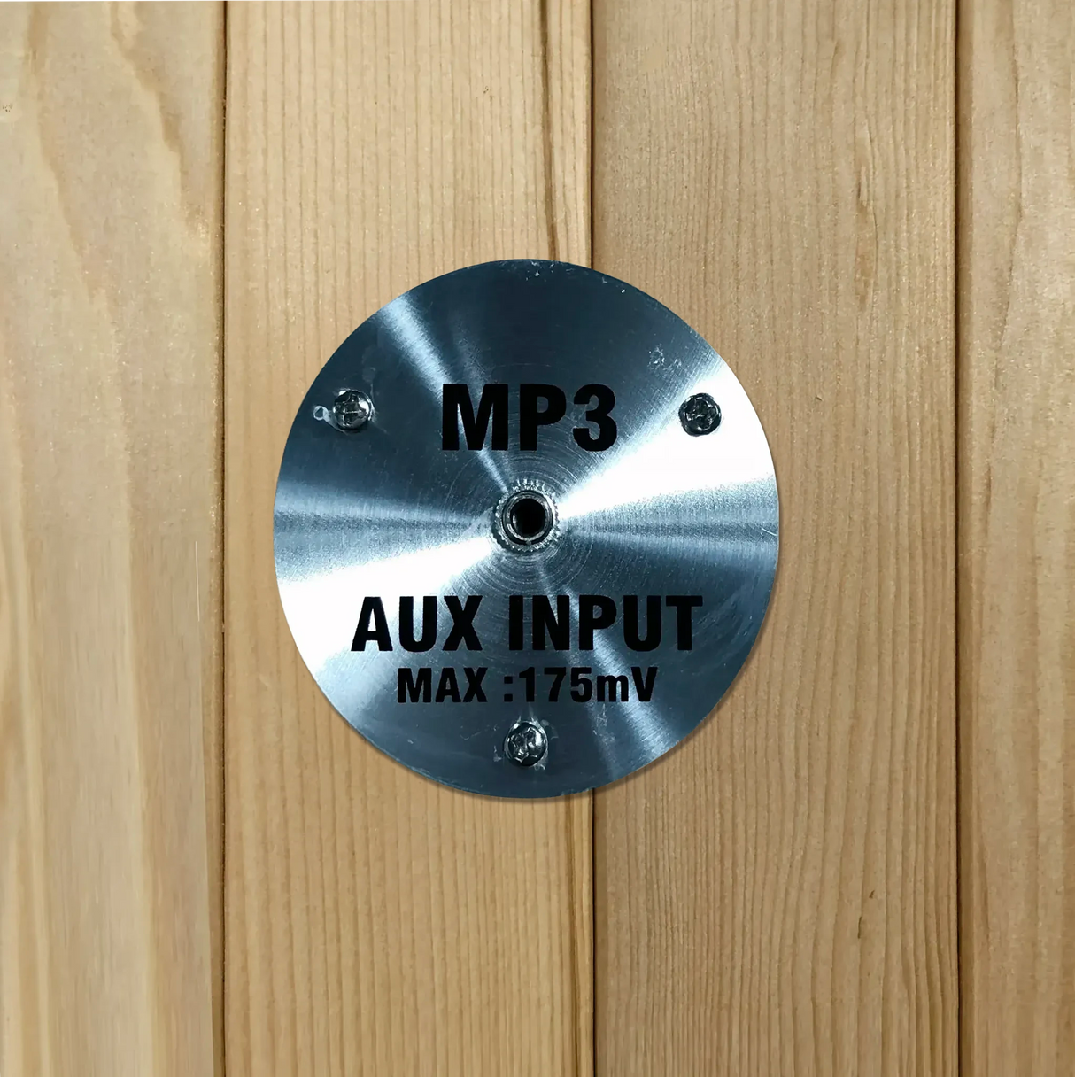 MP3 auxiliary input jack built into a wooden sauna