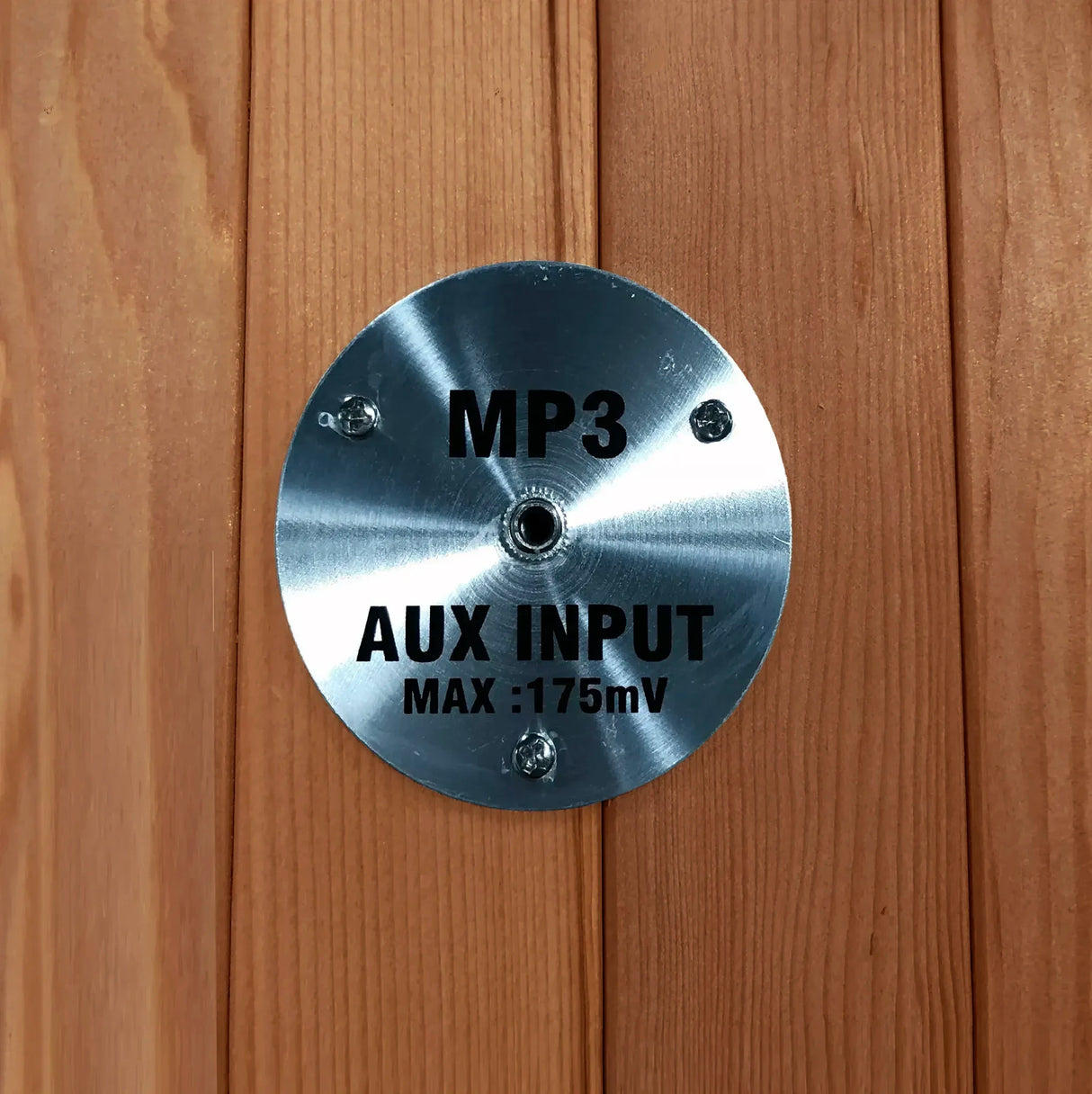 MP3 auxiliary input jack built into a wooden sauna