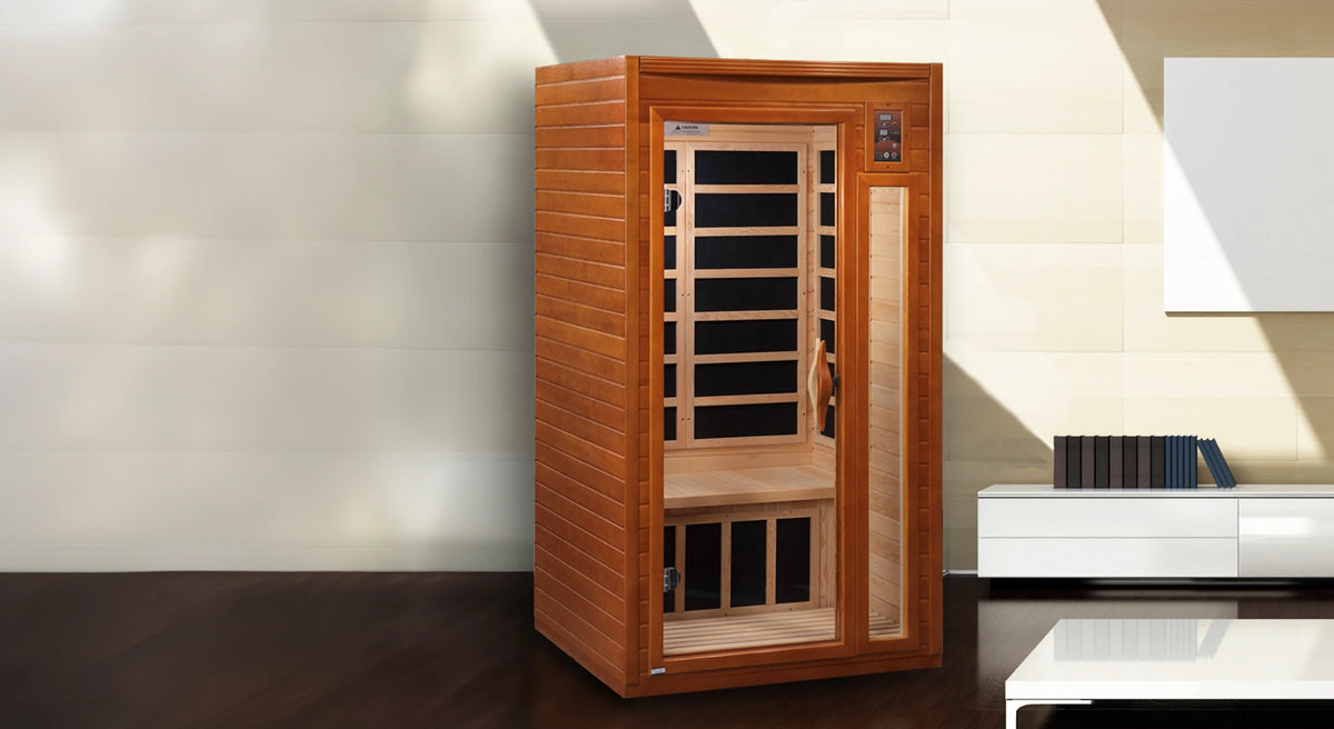 Dynamic Saunas Barcelona model in Canadian Hemlock, offering a compact design with six low EMF carbon heating panels, Bluetooth connectivity, chromotherapy lighting, and a sleek tempered glass door, ideal for 1-2 people with easy installation and minimal maintenance, backed by a 5-year warranty.
