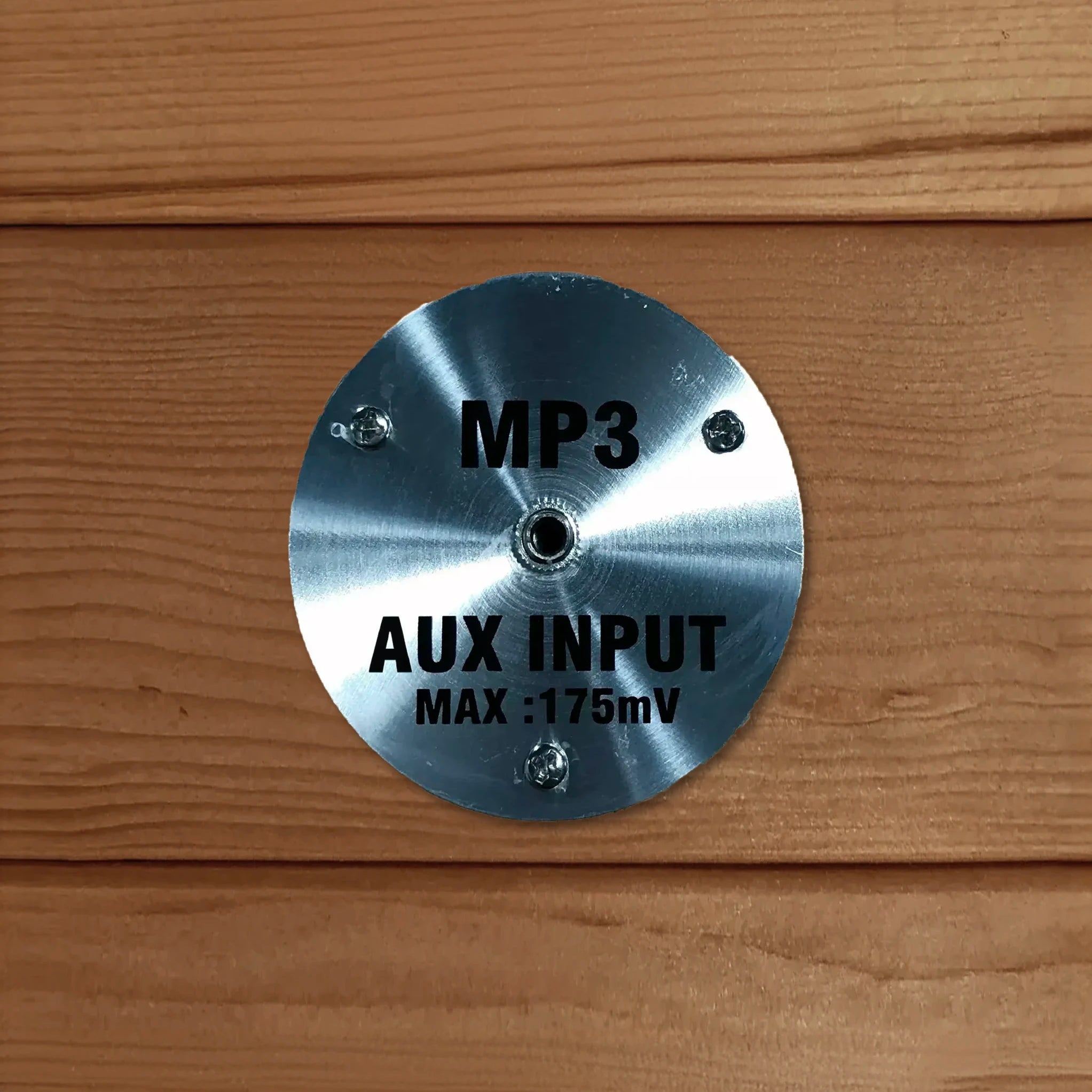 MP3 auxiliary input jack for an AUX cord built inside a sauna