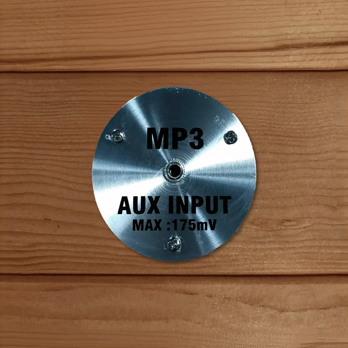 MP3 auxiliary input jack for an AUX cord built inside a sauna