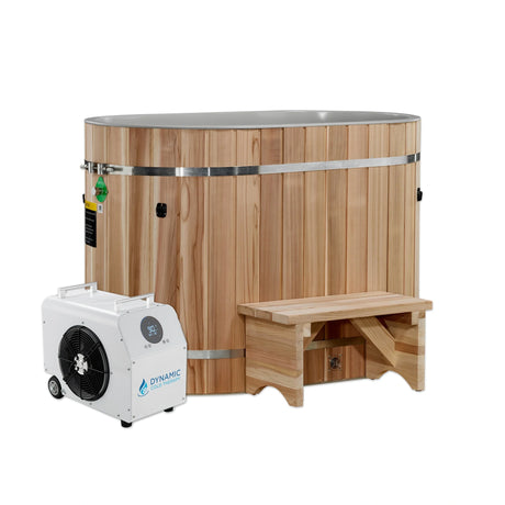 Wooden oval red cedar cold plunge with a portable step and a chiller on a white background