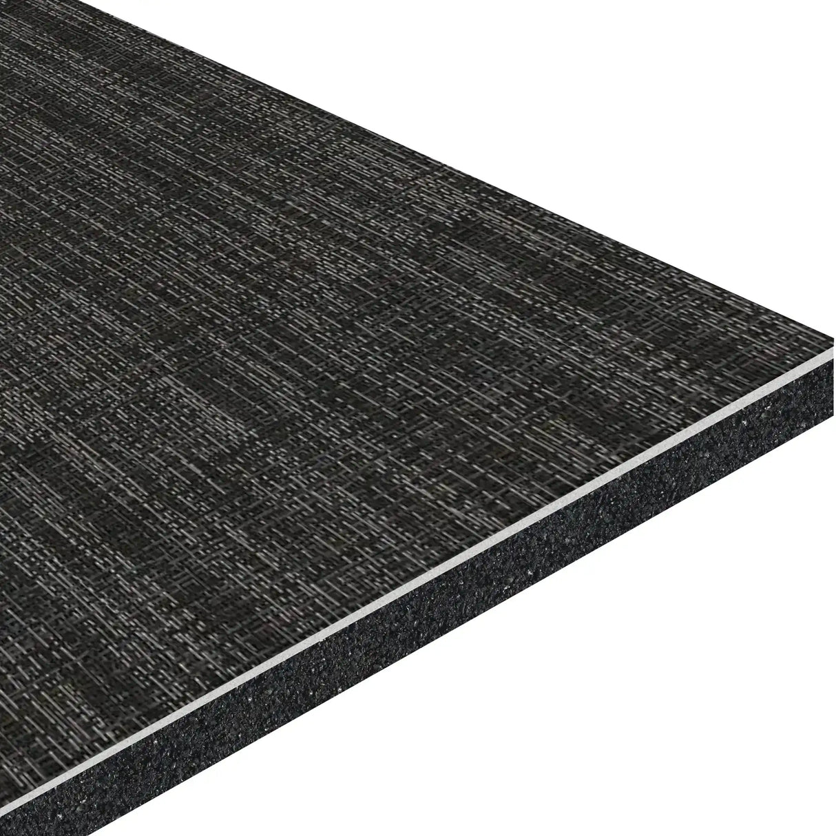 A close-up of the ECORE Ebb & Flow Motivate Laminate Roll - 6mm Class 1 Flooring from ECORE Athletic shows its black, rectangular, textured panel with a woven surface pattern and layered construction at the edges.