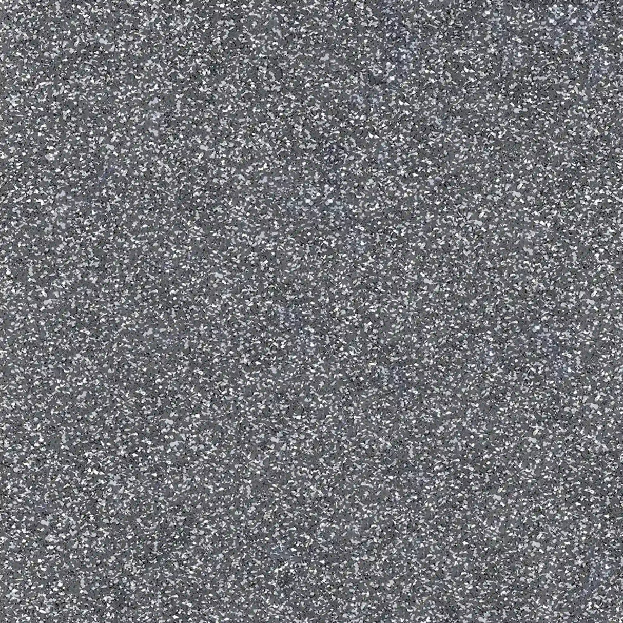 Close-up view of ECORE PlayGuard Rubber Tile - 2.5" Playground Flooring by ECORE Athletic, revealing its rough gray surface with light and dark specks that showcase the textured look of this durable playground flooring.