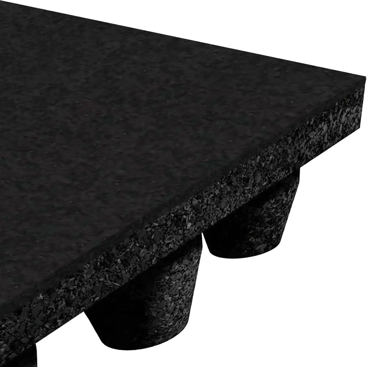 A close-up of the ECORE Athletic ECORE Performance dBTile Rubber Tile – 2.5" Acoustic Flooring in black shows its textured surface at an angle, with several raised round support cones made of rubber on the underside.