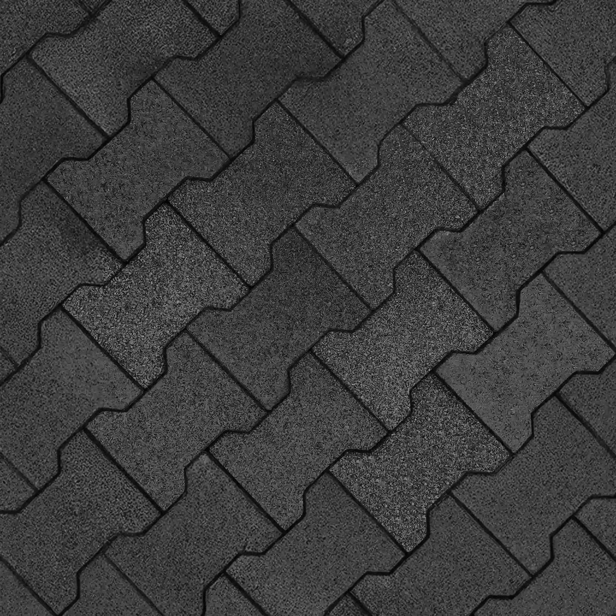 ECORE Athletic's ECORE Rubber Paver, 1" (24 mm), in dark gray features interlocking pieces forming a zigzag pattern with visible seams and subtle shade variations for a textured, durable surface.