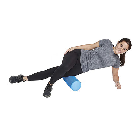 Woman rolling quad on short foam roller with extra grip by Perform Better