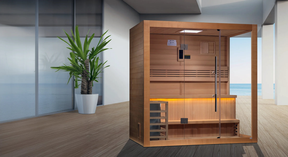 Golden Designs Forssa model traditional steam sauna built for indoor or covered outdoor use constructed from Canadian red cedar on the inside and Canadian hemlock on the outside with a four person capacity on a covered deck overlooking the ocean