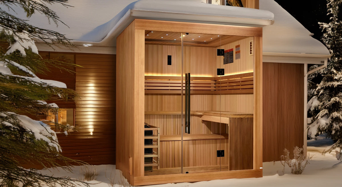 Golden Designs Osla model traditional steam sauna built for indoor or covered outdoor use constructed from Canadian red cedar on the inside and pacific cedar on the outside with a six person capacity under a roof positioned on the side of a house