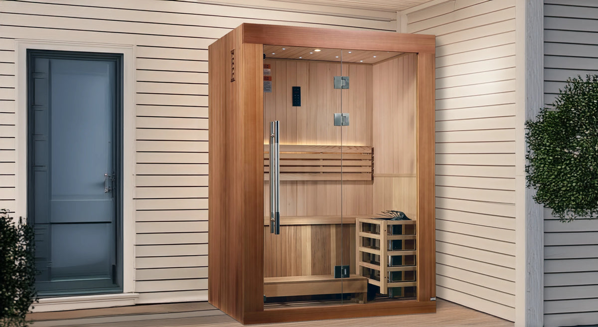 Golden Designs Sundsvall model traditional steam sauna built for indoor or covered outdoor use constructed from Canadian red cedar on the inside and pacific cedar on the outside with a two person capacity under an overhang on the back porch of a house