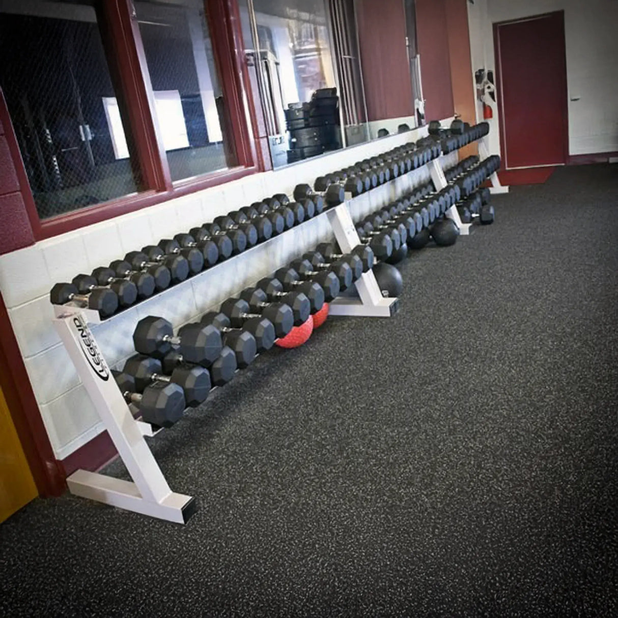 Row of dumbbells on a few racks in a gym setting