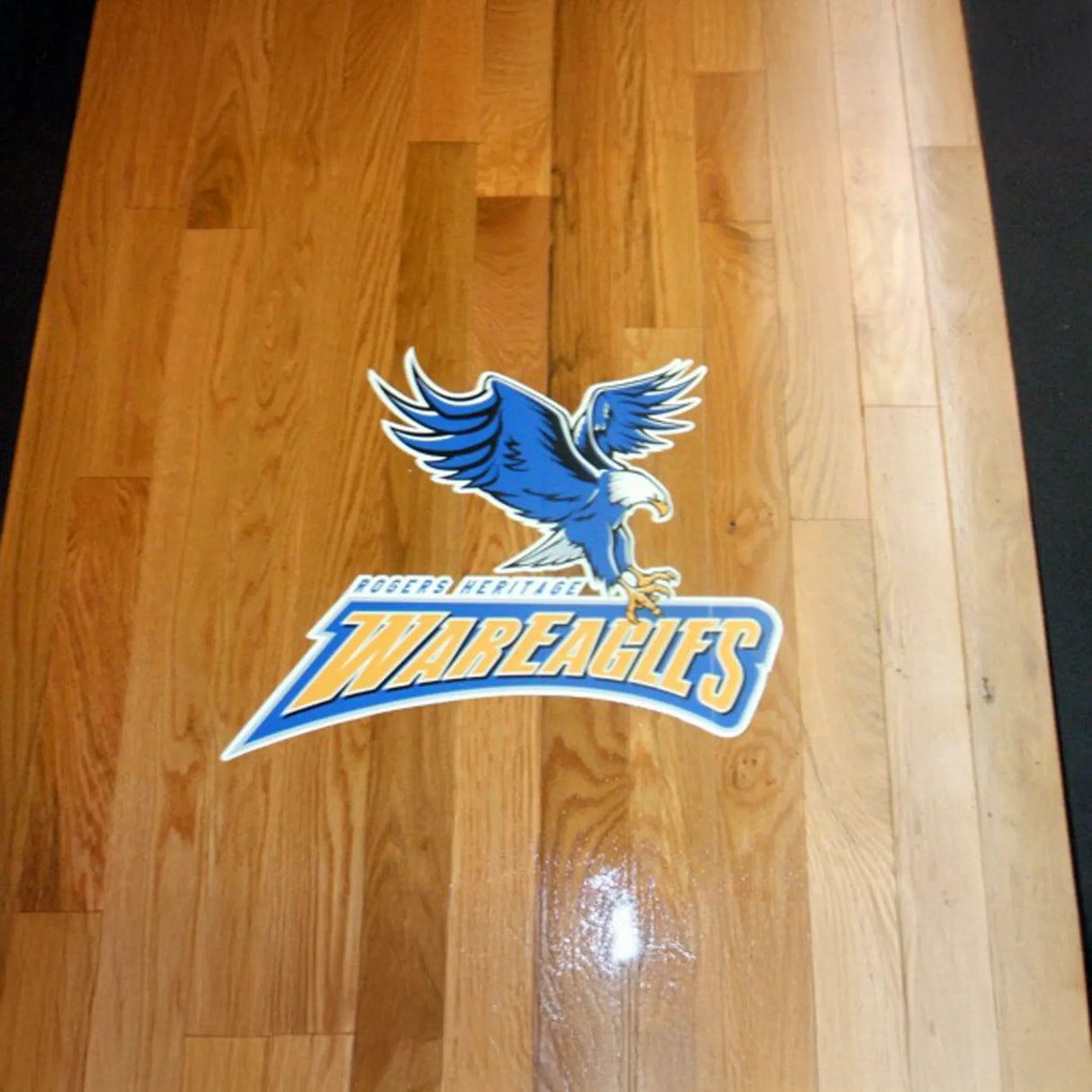 WarEagles logo on a wooden floor