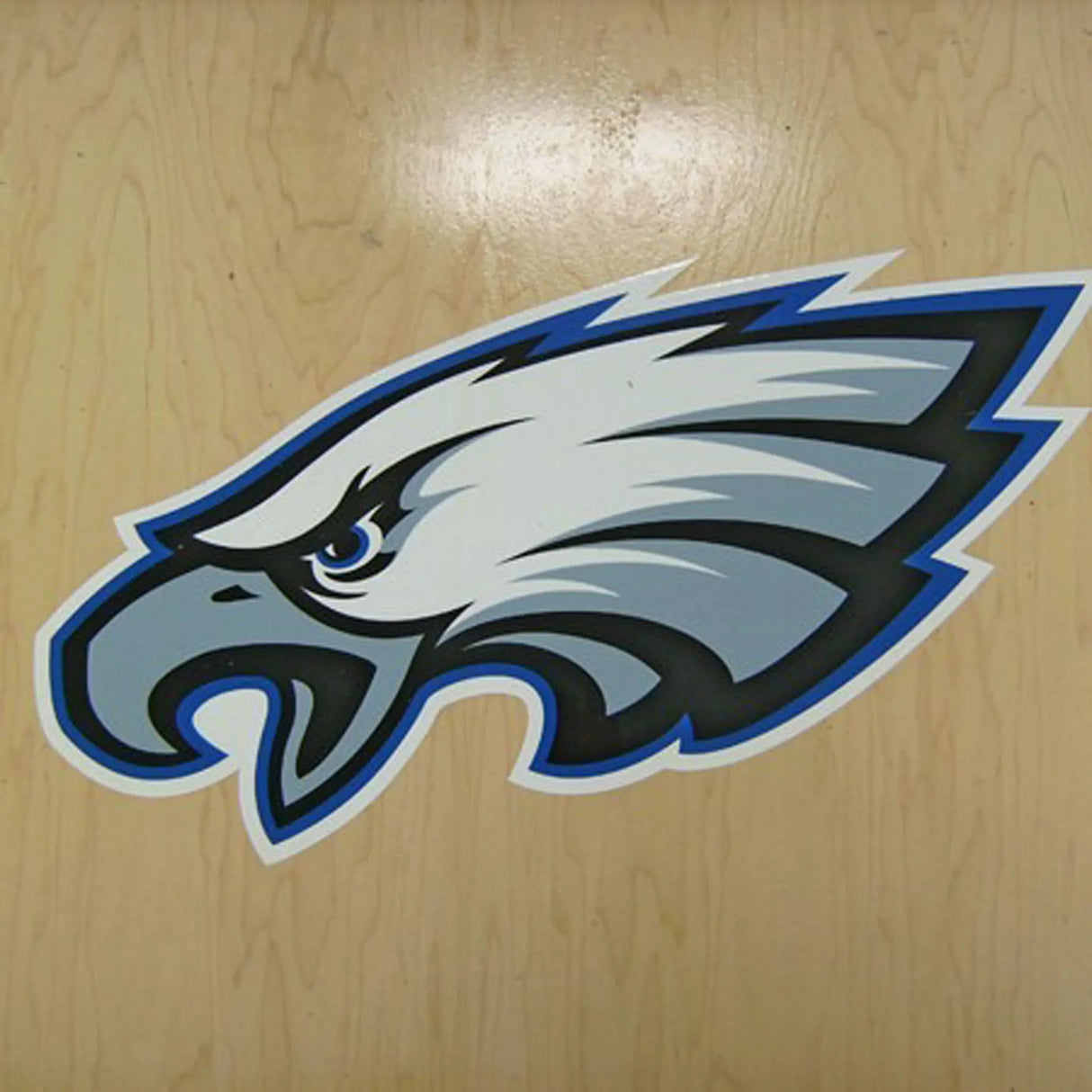 Eagle logo on a wooden surface