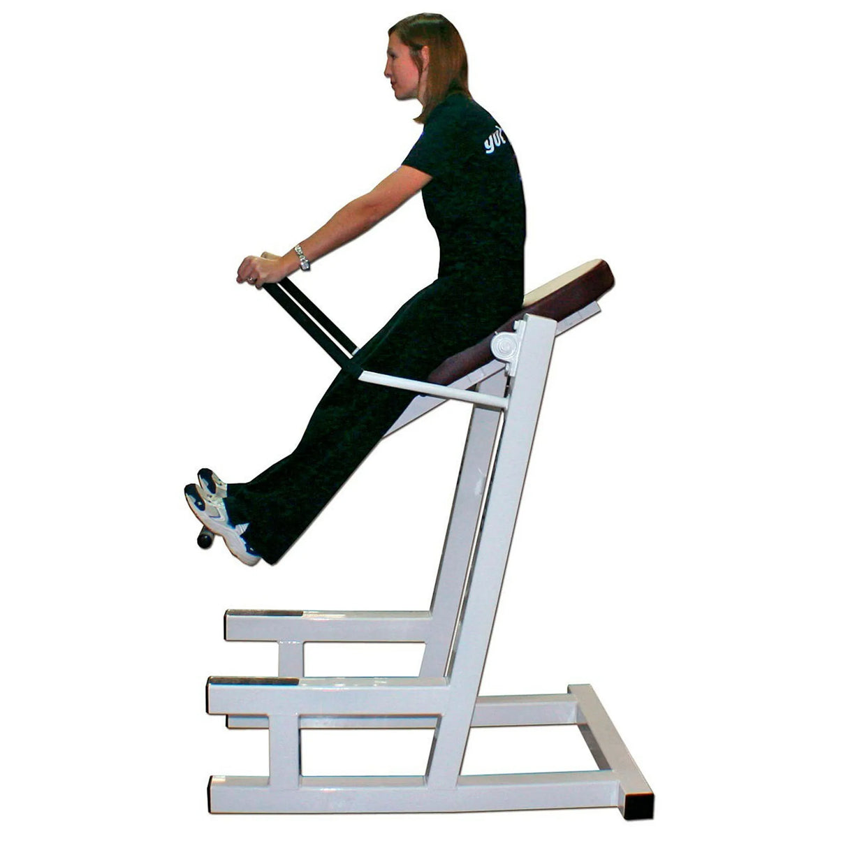 A person using a fitness core machine on a white background.