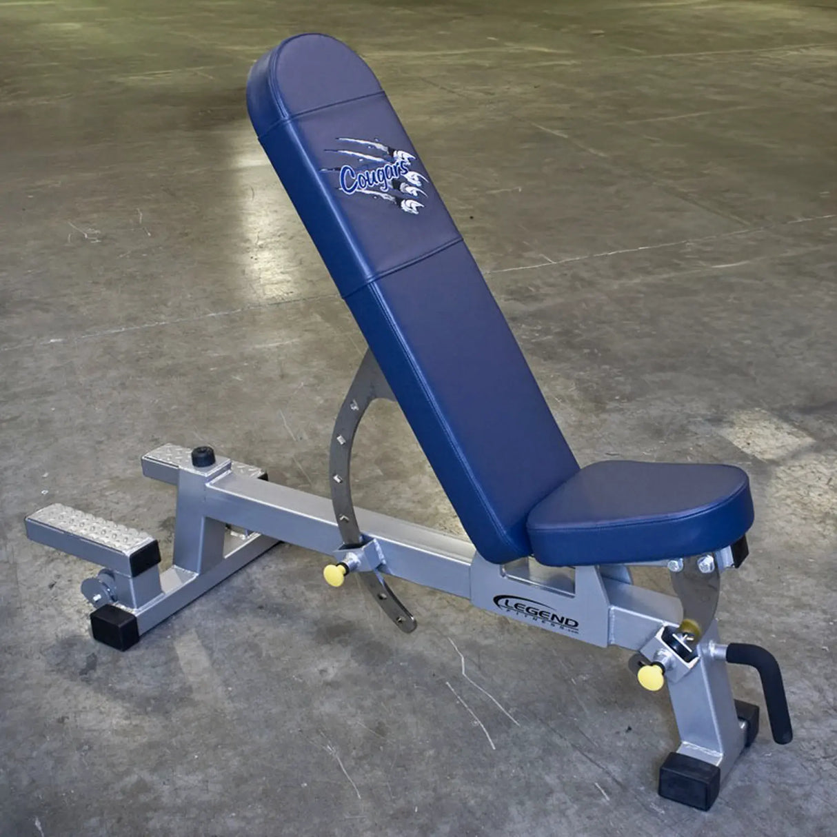 Blue weight bench with 'Legend' branding on a concrete floor