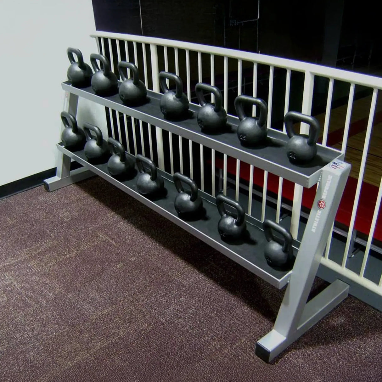 Set of kettlebells on a rack in a gym setting