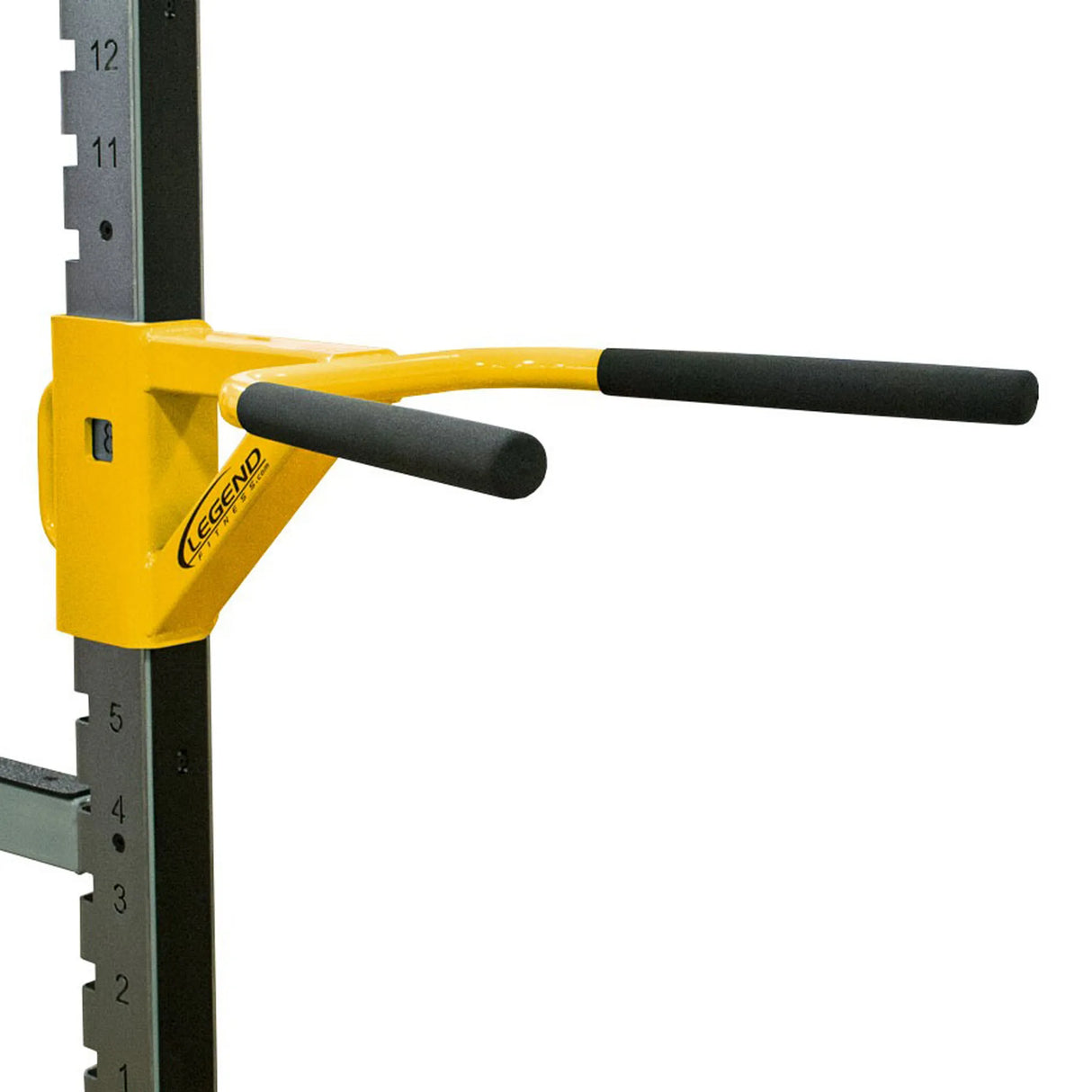 A yellow and black dip attachment mounted to the side of a squat rack
