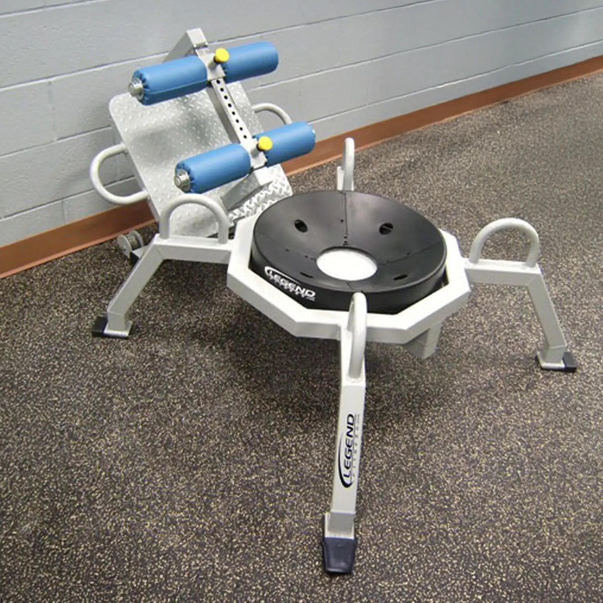 A piece of fitness equipment on a rubber gym floor
