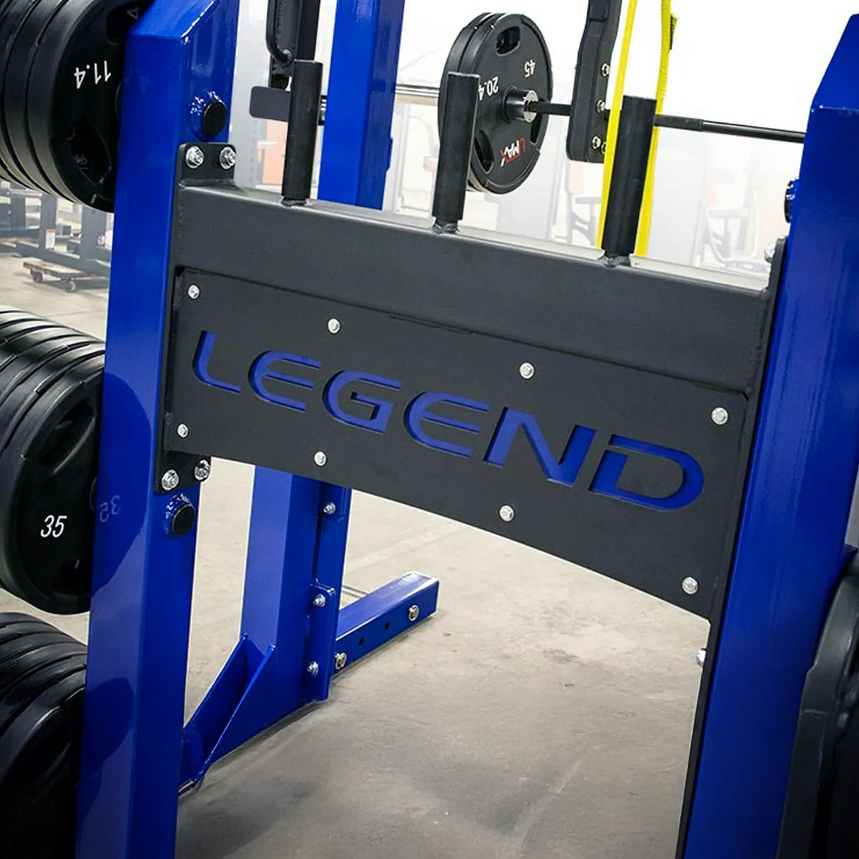 Blue weightlifting rack with 'Legend' branding in a gym setting