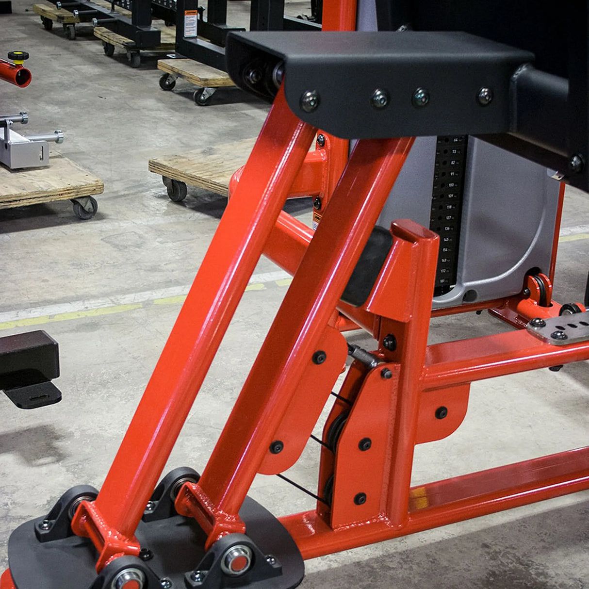 Red mechanical device on a concrete floor in an industrial setting