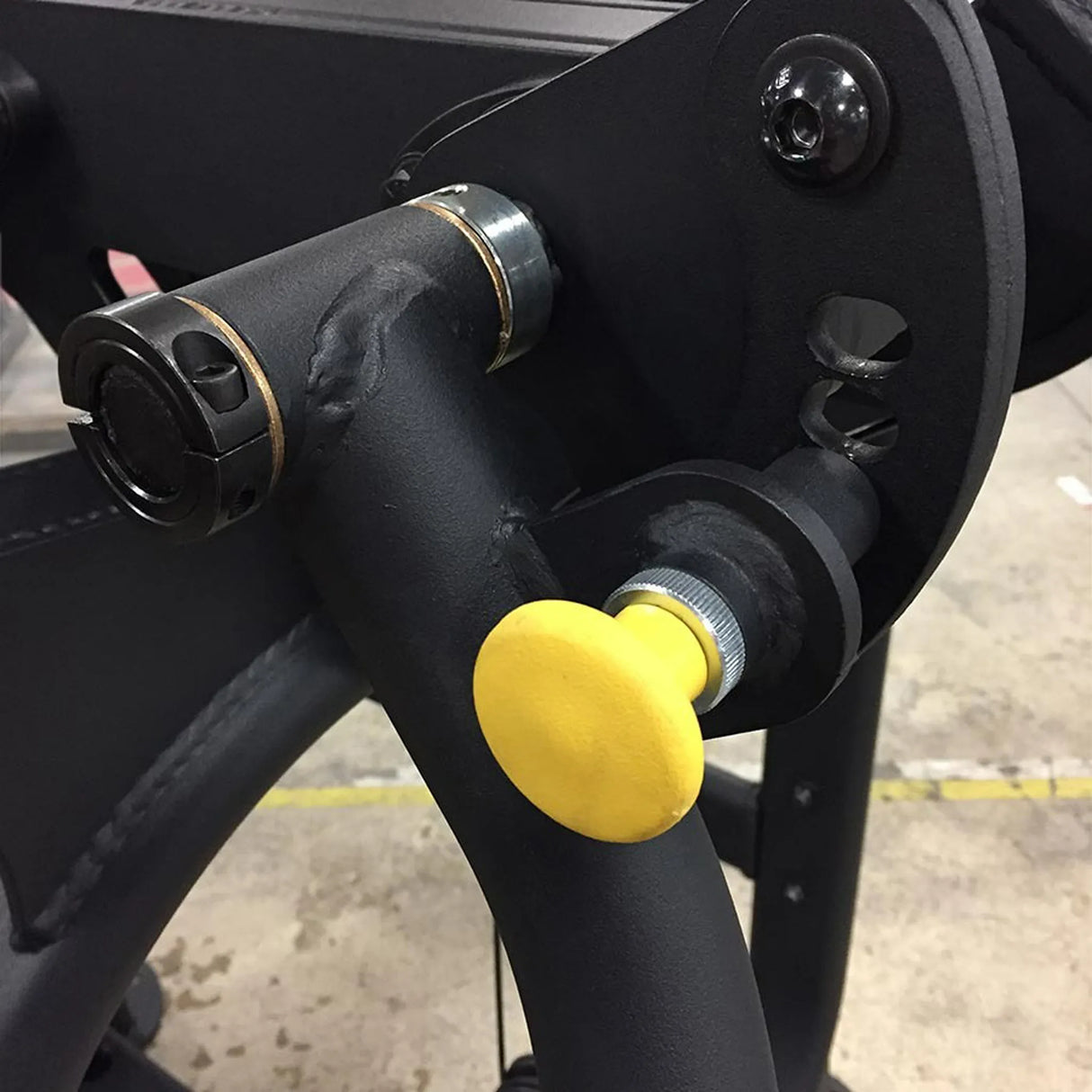 Black metal components with a yellow pop-pin
