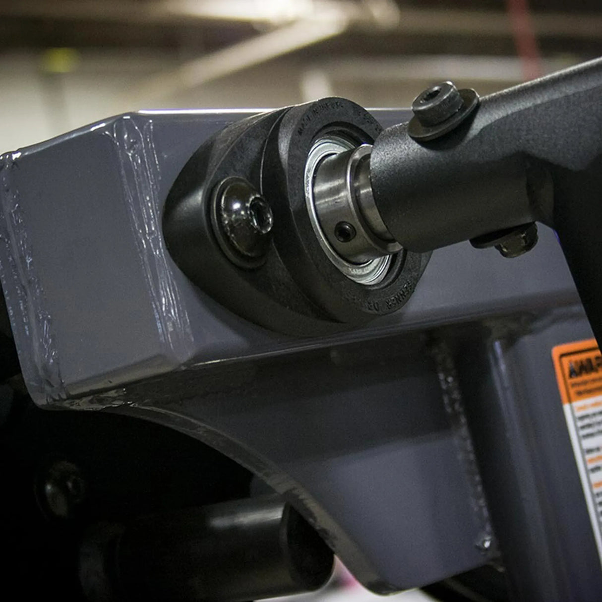 Close-up of a mechanical component with a bearing and metal parts.