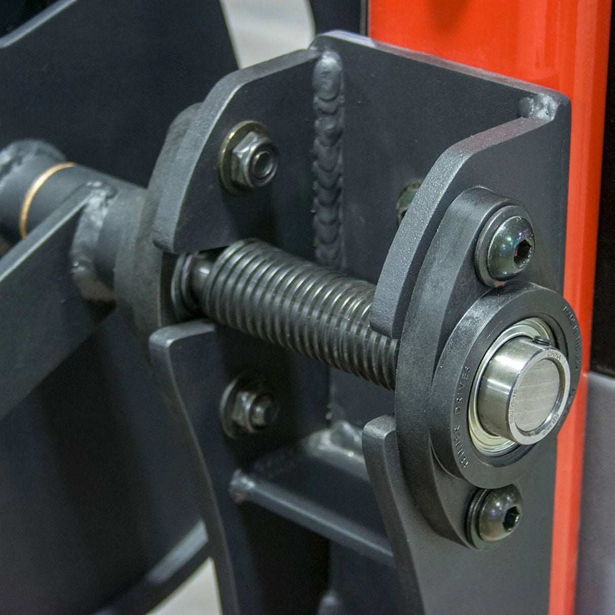 Close-up of a mechanical component with a red background