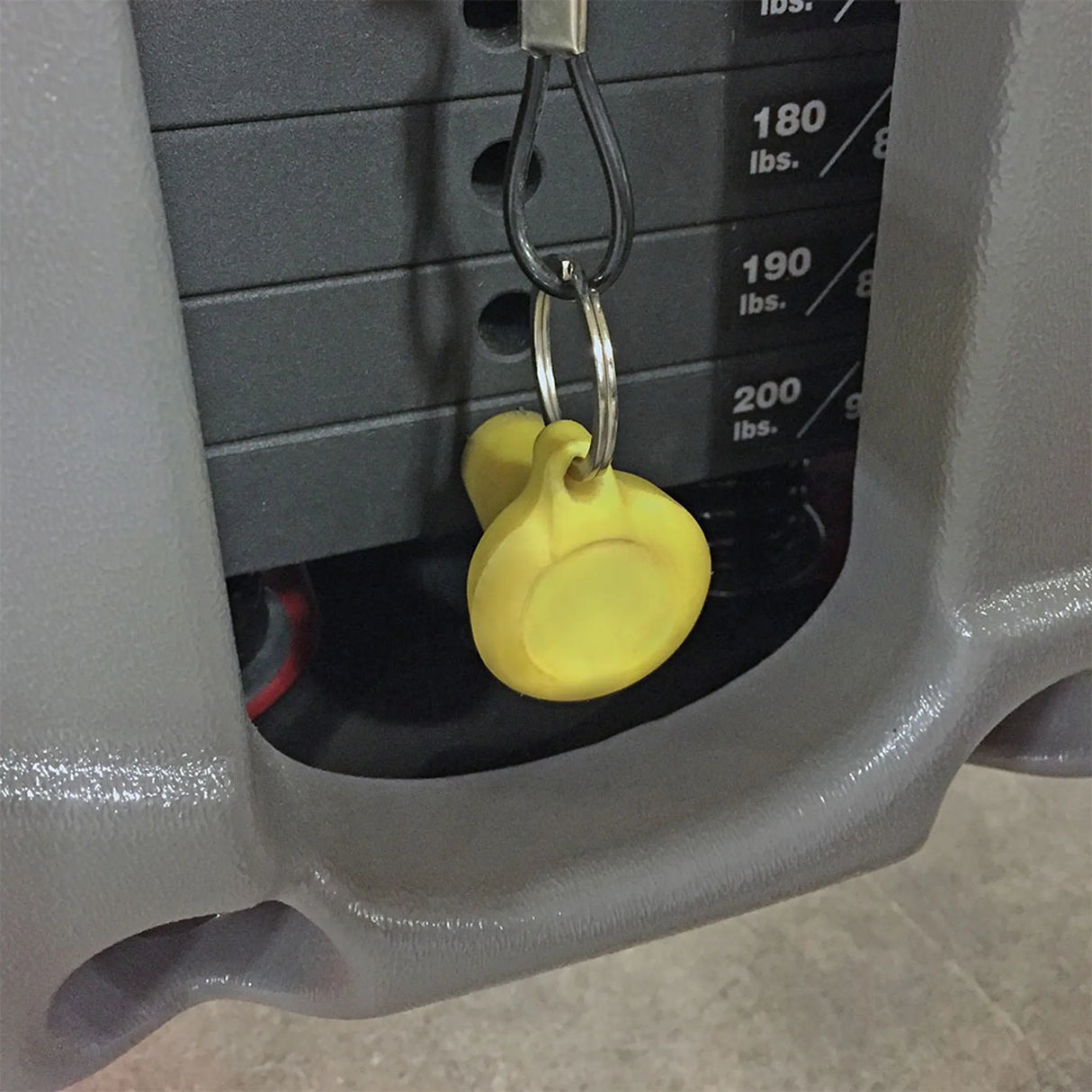 A yellow selector pin in a 200 lb weight stack