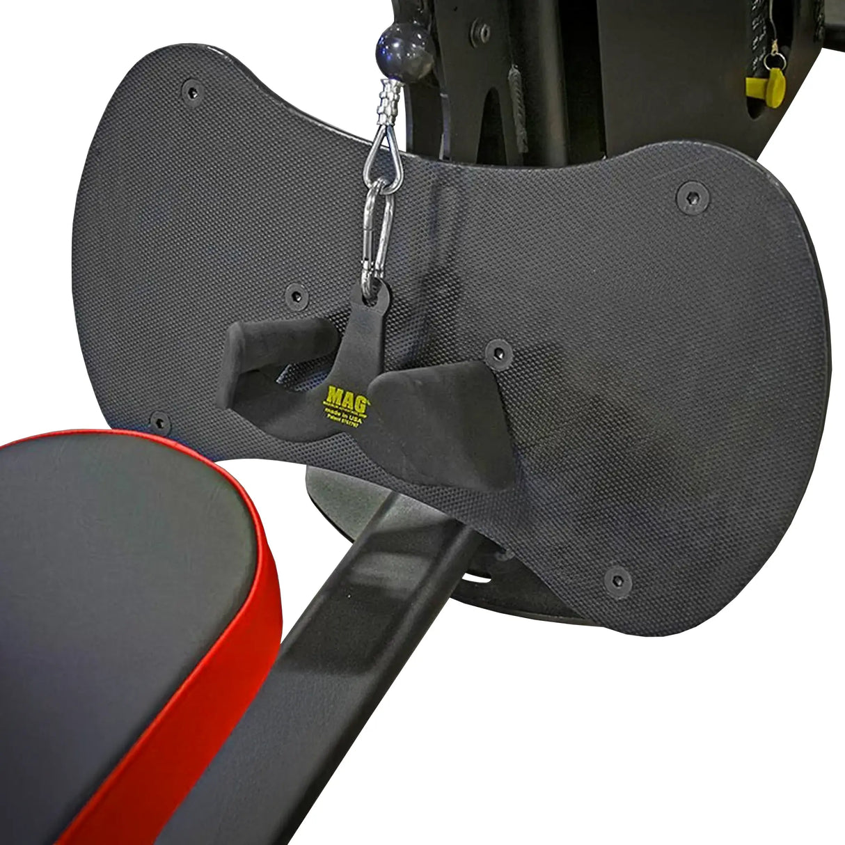 Closeup image of a black footplate with a MAG brand low row grip and a black and red bench