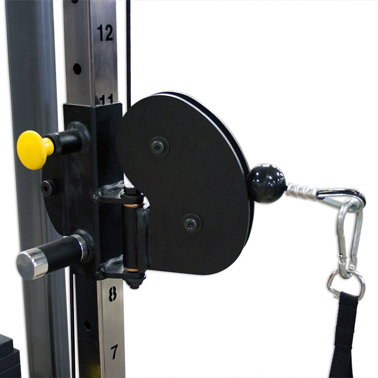 Black pulley with a yellow pop-pin on a piece of gym equipment with a white background