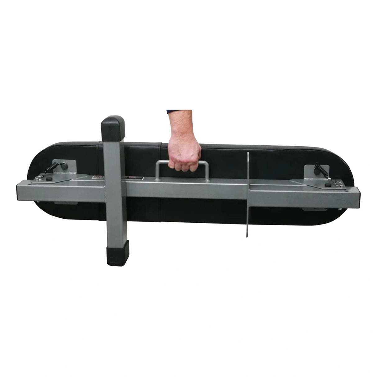 A closeup image of a PowerBlock Fold Up Portable Travel Bench in the folded position being carried by a man