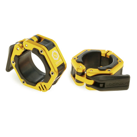 A pair of black and gold Lock-Jaw metal barbell collars with visible branding and magnets on the inside.
