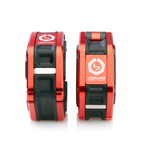A pair of red and black Lock-Jaw metal barbell collars with visible branding and magnets on the inside.