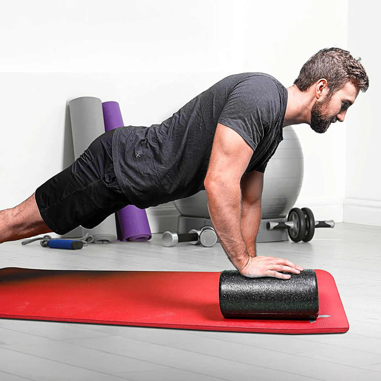 Man doing pushup on short foam roller by CanDo