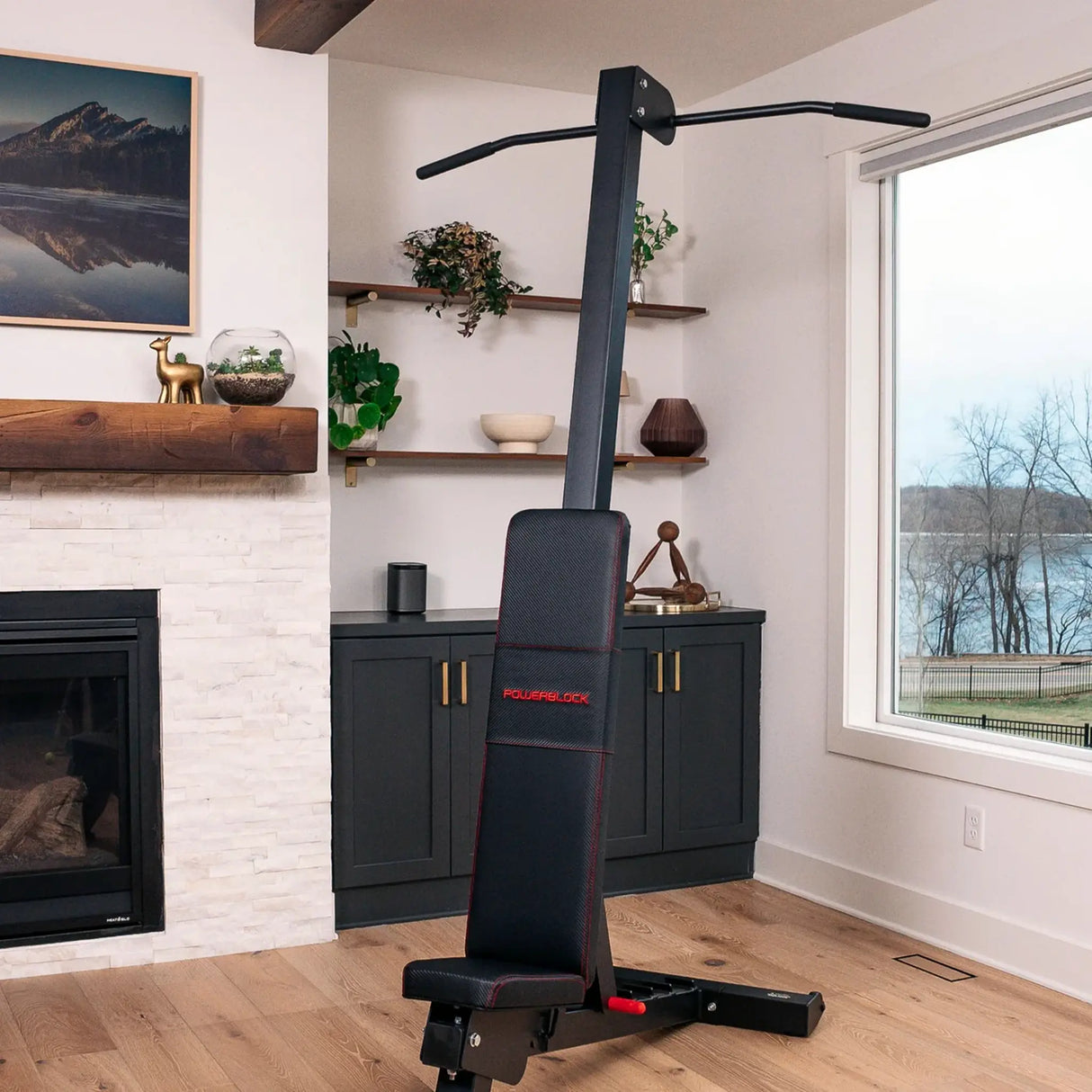 A PowerBlock bench with a chin-up attachment attached to the back