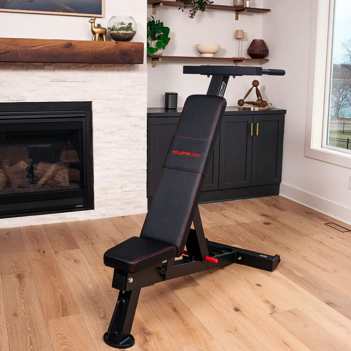 A PowerBlock bench with a dip attachment attached to the back