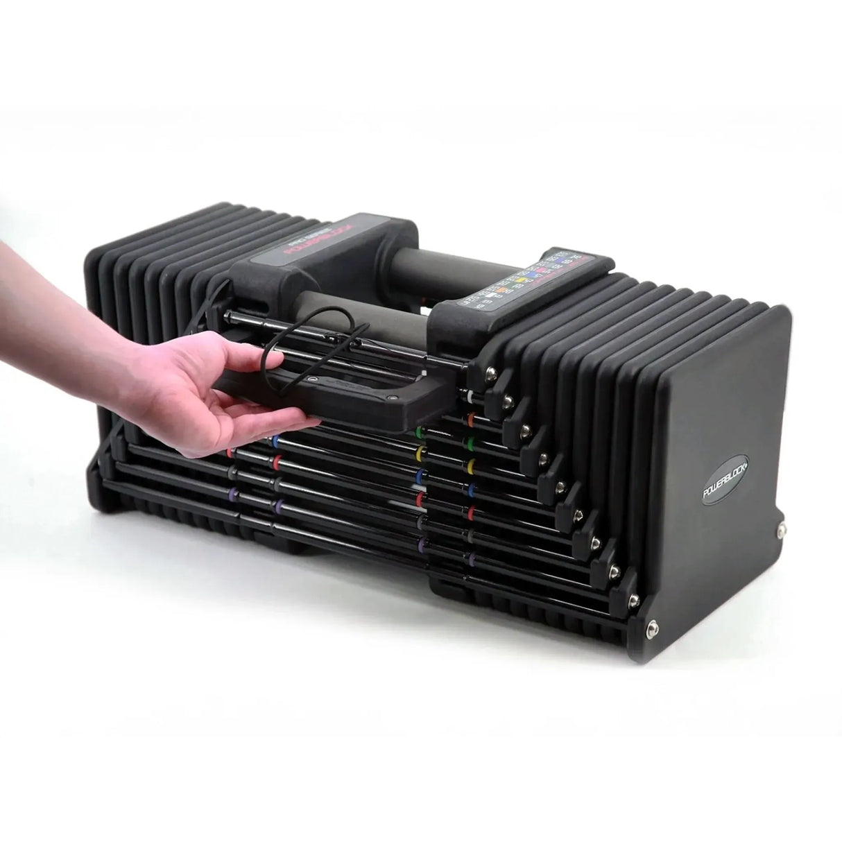 A PowerBlock Commercial Pro 175 Dumbbell with a man pulling out the side pin