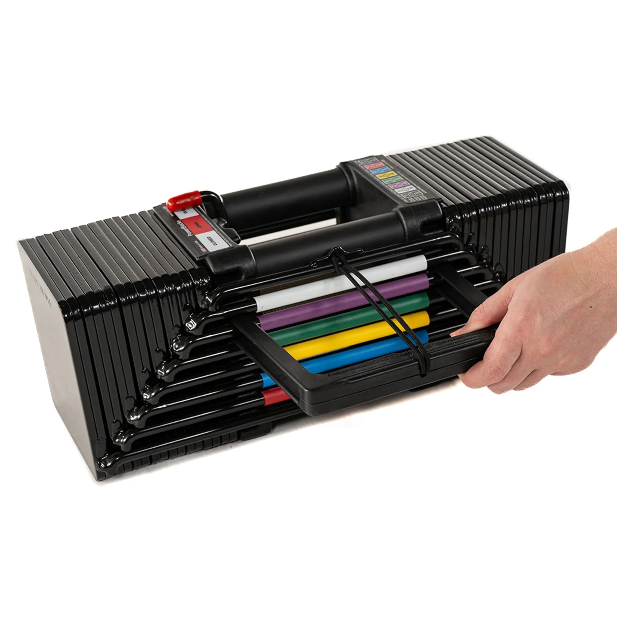 A man removing the weight adjustment pin from the side of a PowerBlock Elite USA 90 dumbbell