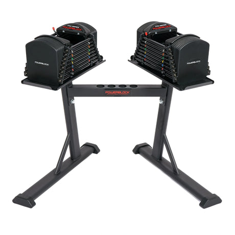 A PowerBlock PowerMax Stand with dumbbells on it