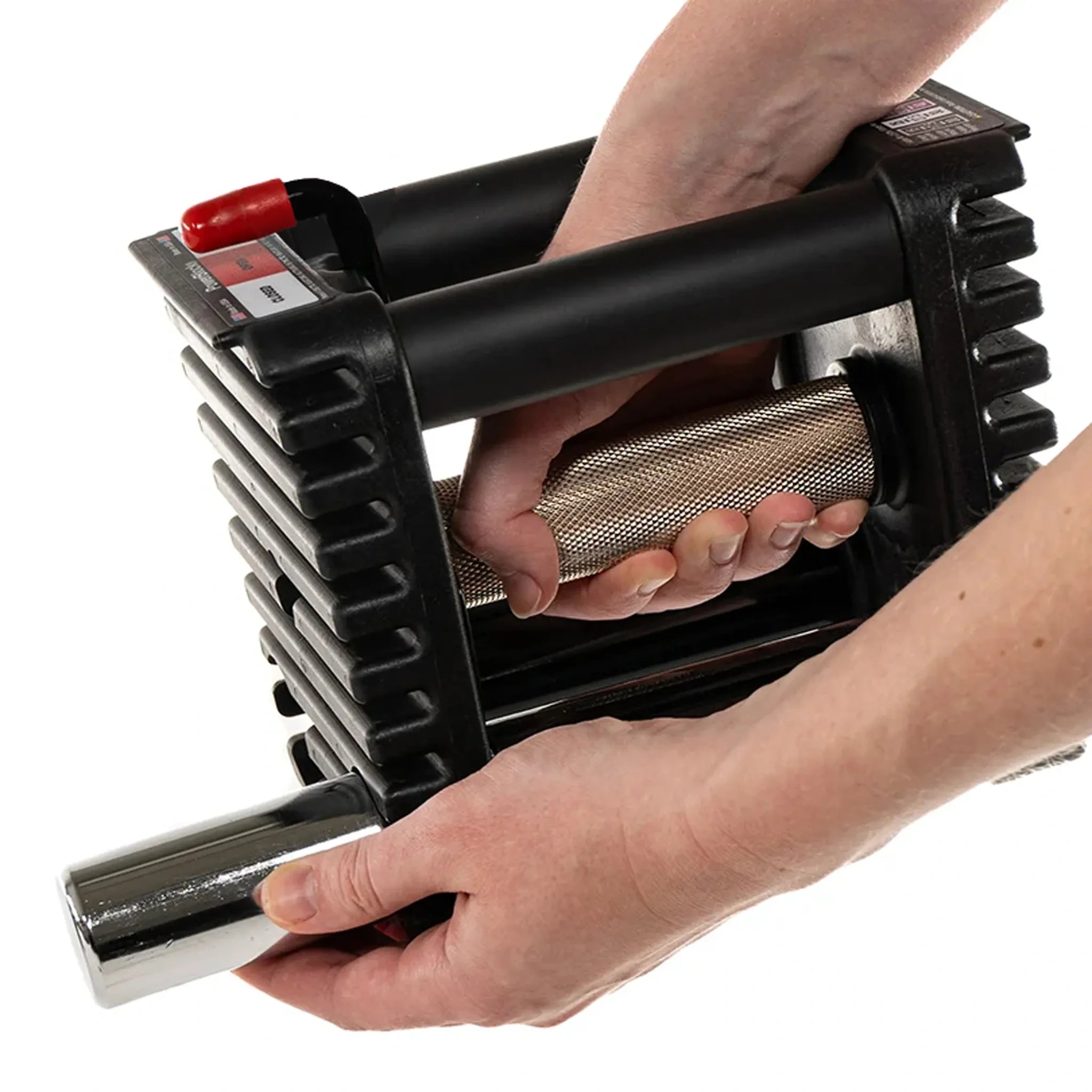 A man removing the adder-weight pin from a PowerBlock Elite USA 90 dumbbell
