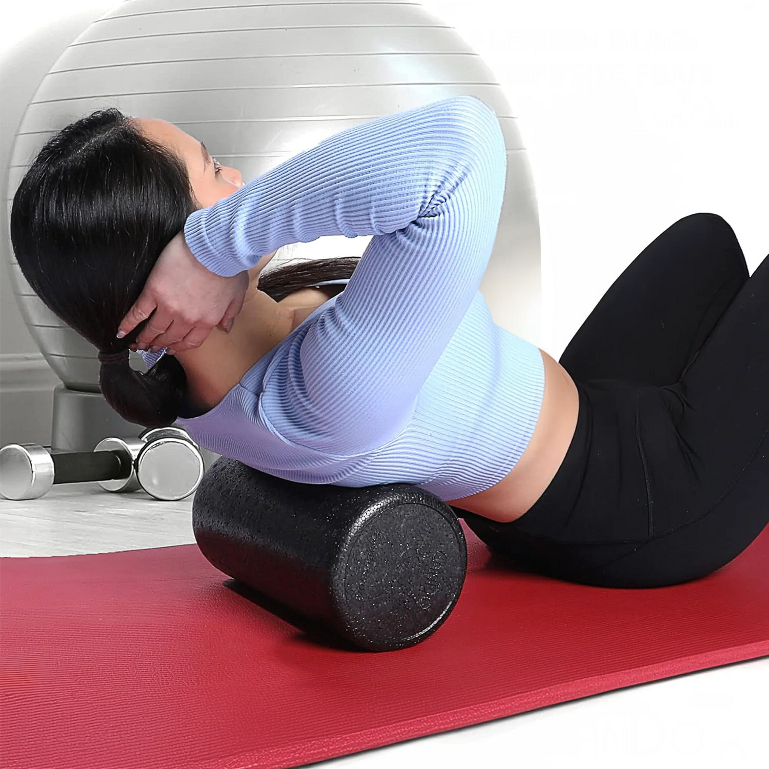 Woman rolling back on high density short foam roller by CanDo