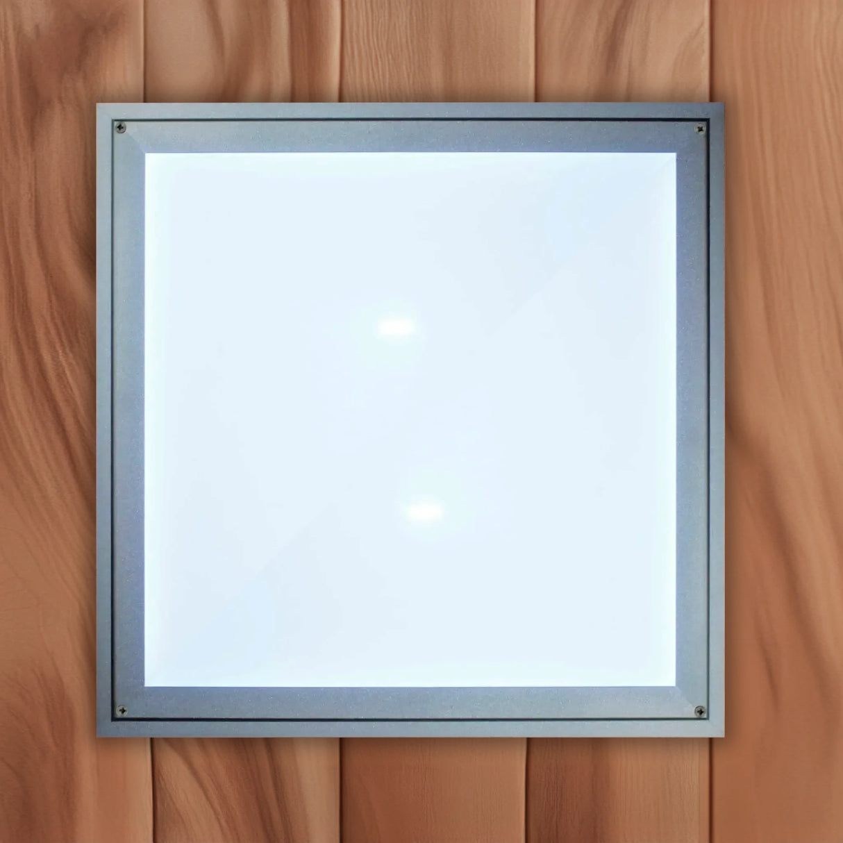 The white cover on a chromotherapy lighting system found inside of a Canadian red cedar sauna sold by Blue Sky Fitness Supply